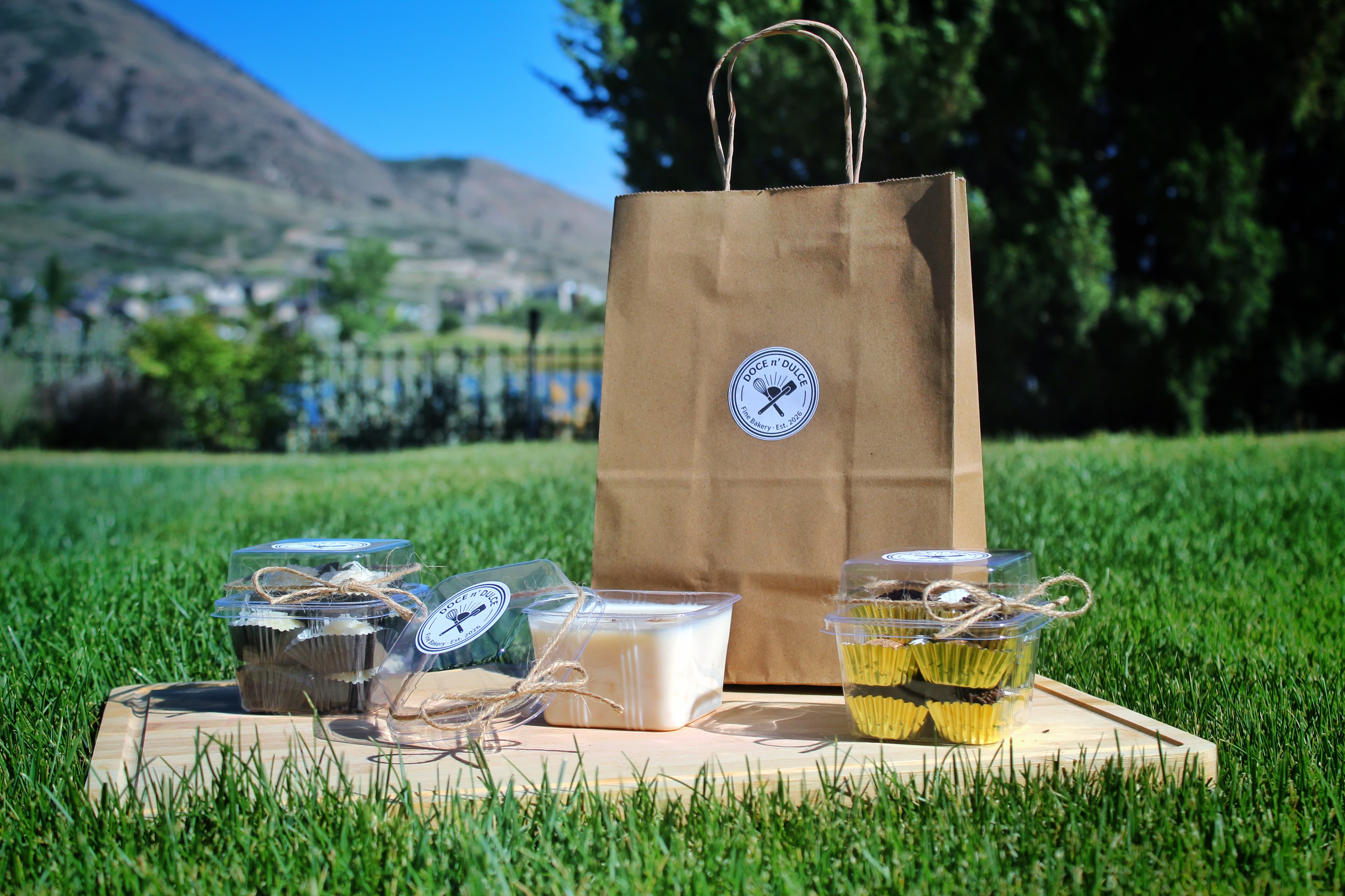 A spread of Doce n' Dulce treats with the Utah mountains behind